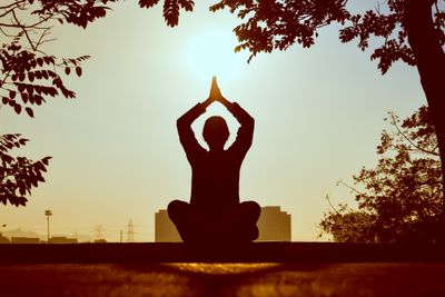 Yoga by the sea at sunrise