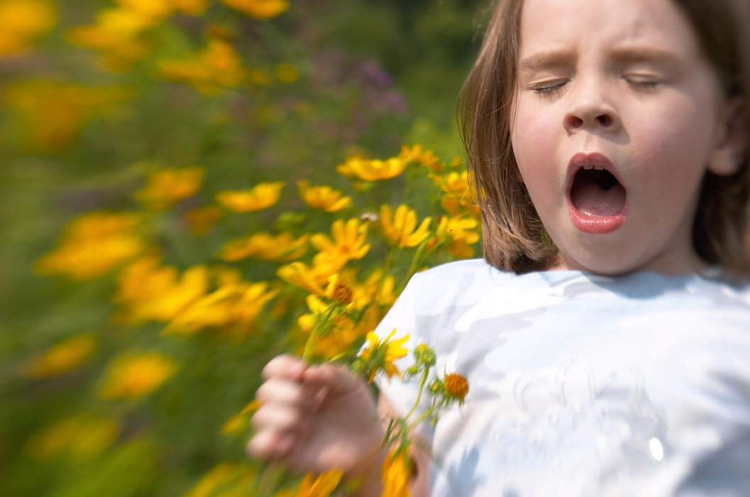 Girl sneezing plant allergy season