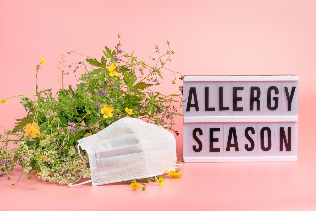Allergy season with plants and a mask