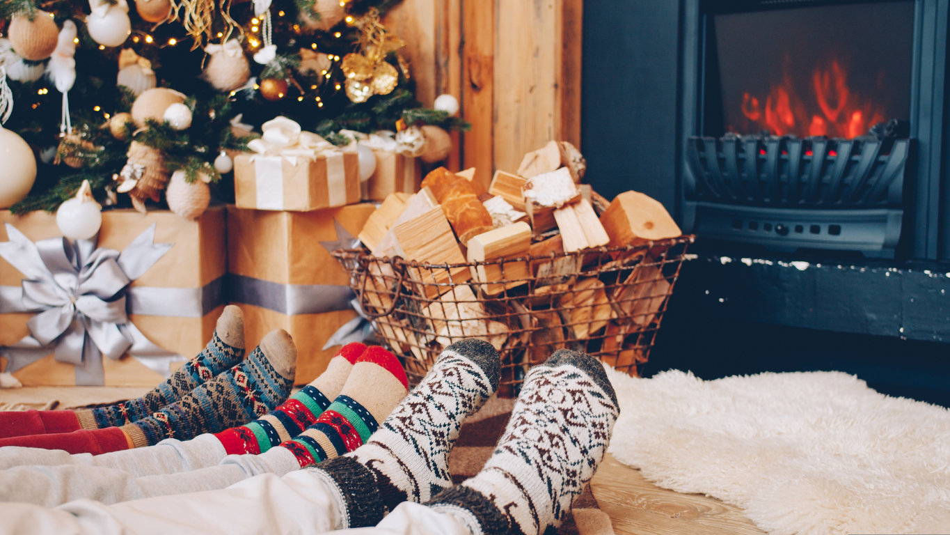 family warming feet by fire