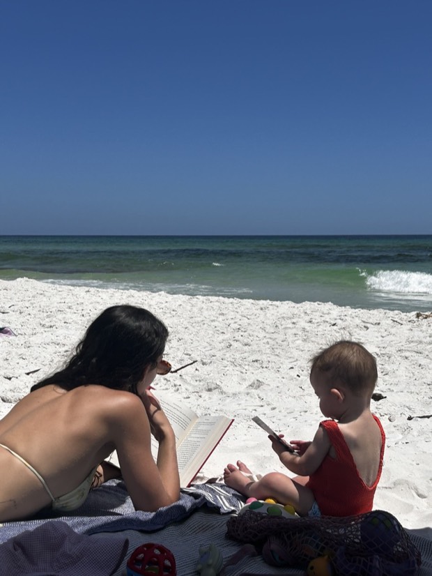 Rachel on the beach next to her daughter