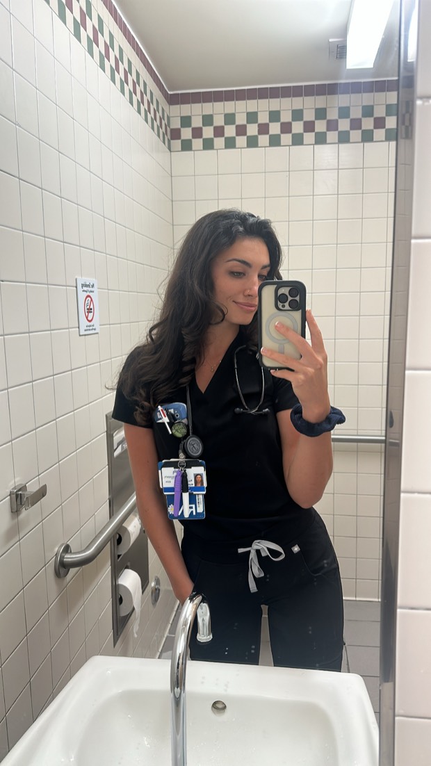 Rachel in black scrubs during a nursing shift
