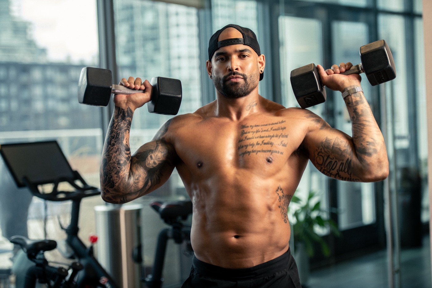 Andre Tate' training with dumbbells