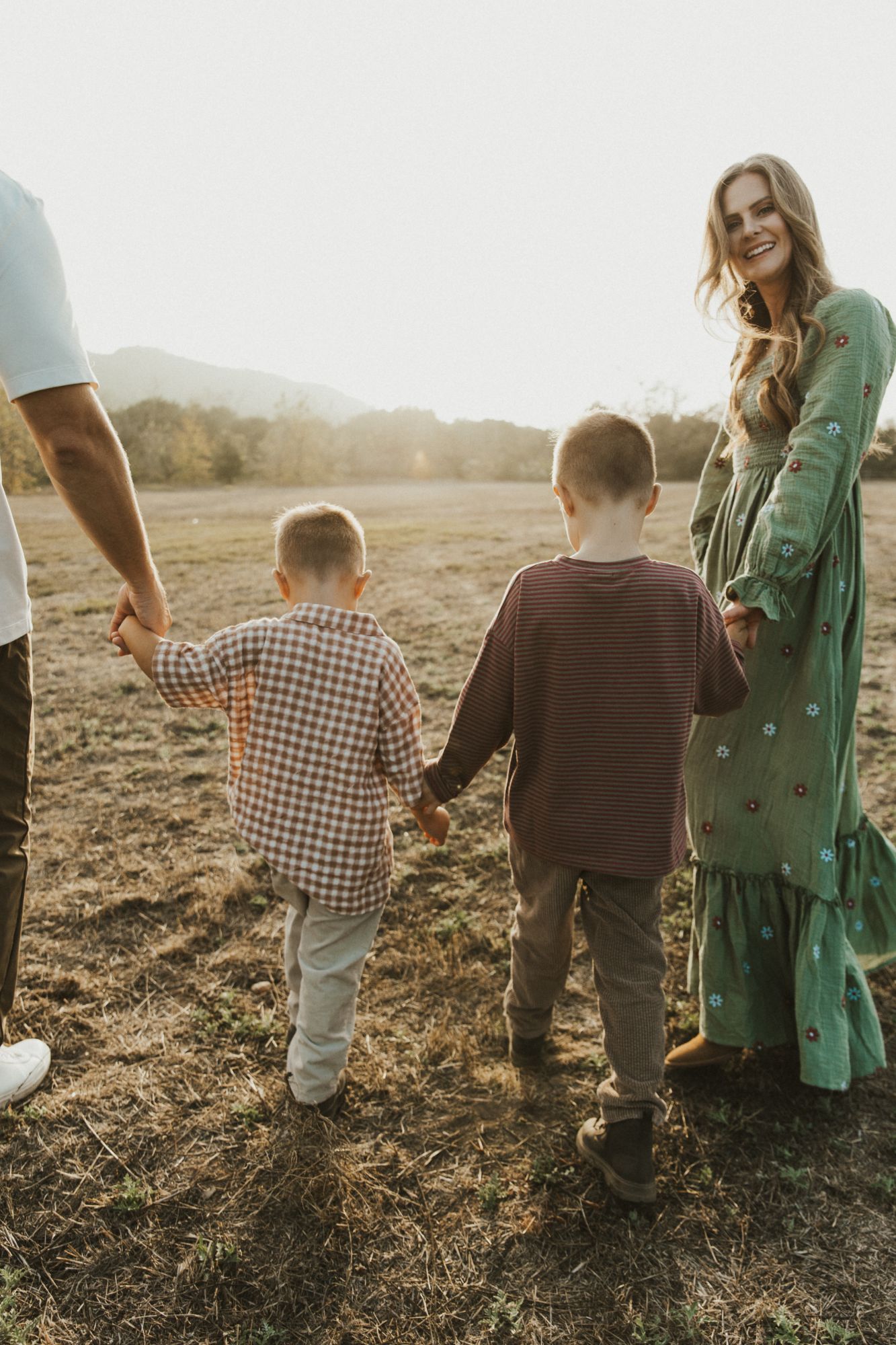 Ashley looking back while walking with her boys