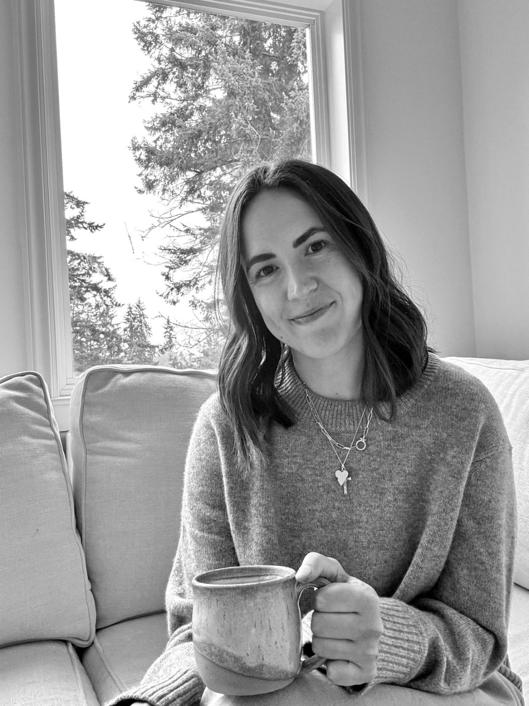 Allie Williams at home, holding a mug.