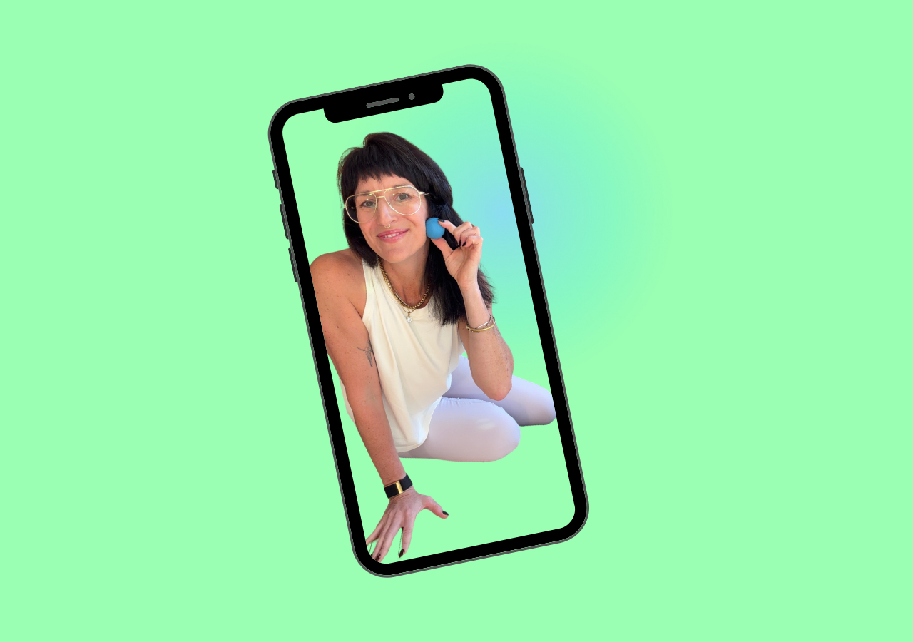 Summer using a RAD ball on her jaw, shown on a phone