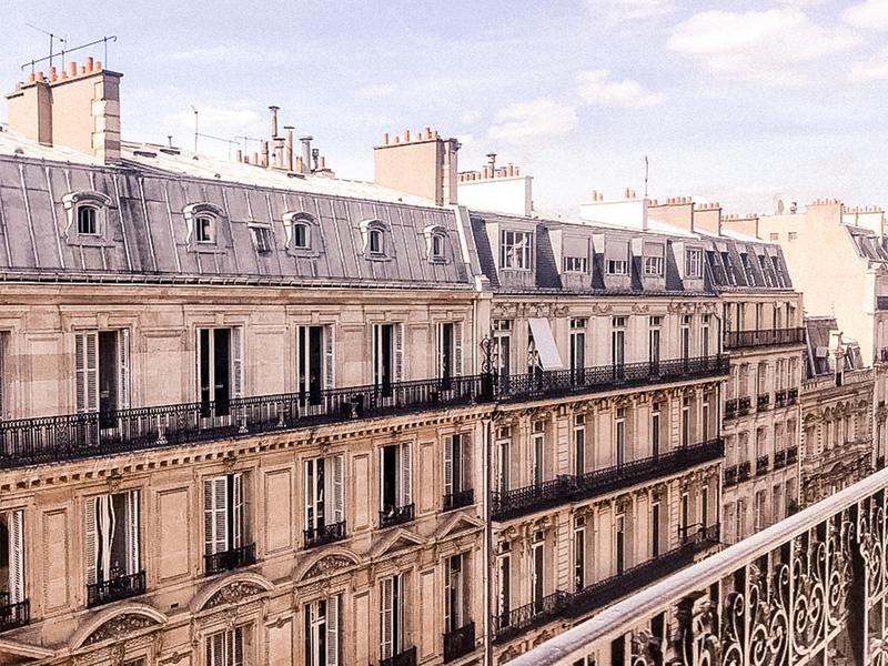 Parisian hotel facades with wrought iron balconies