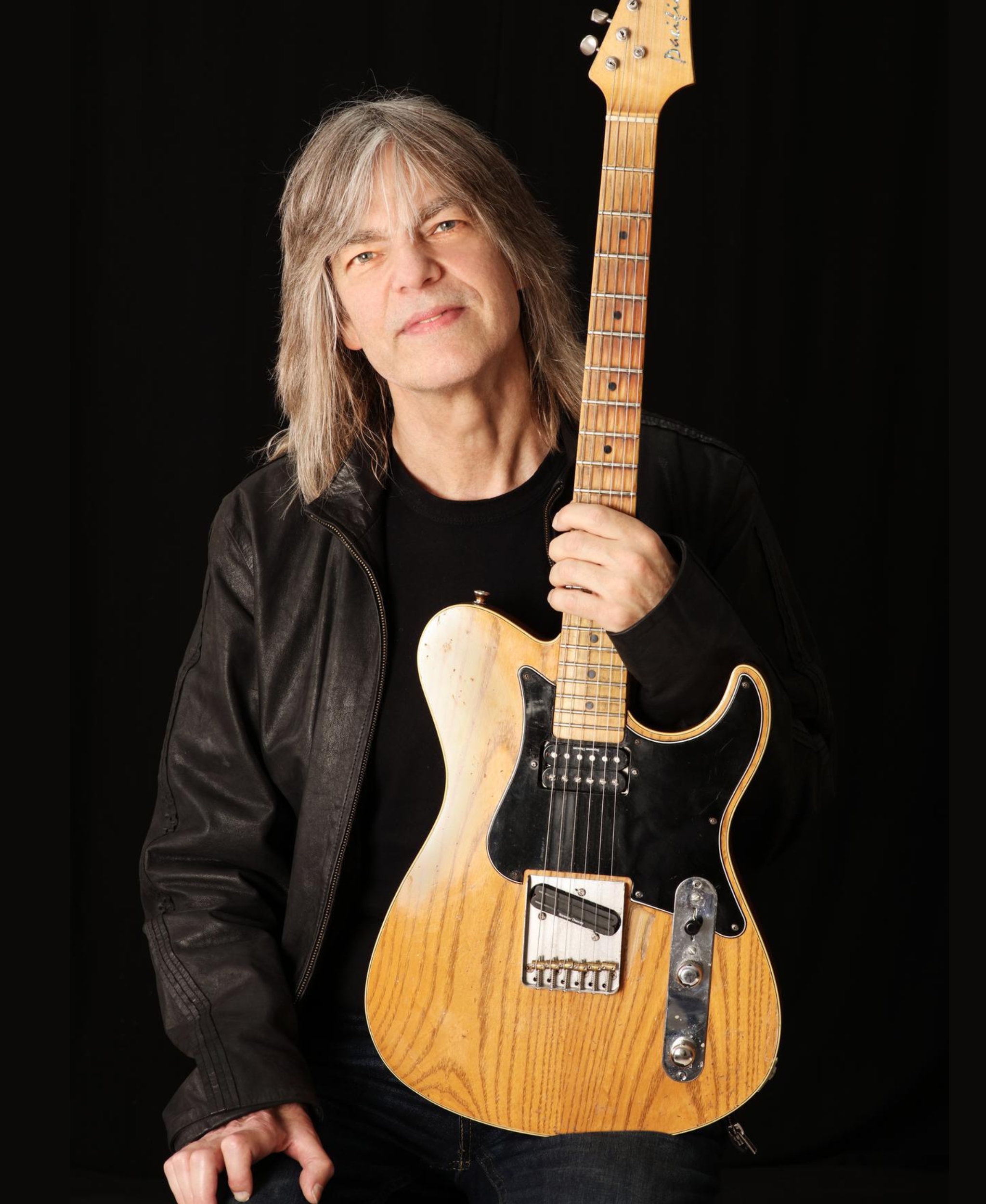Mike Stern holding his Telecaster