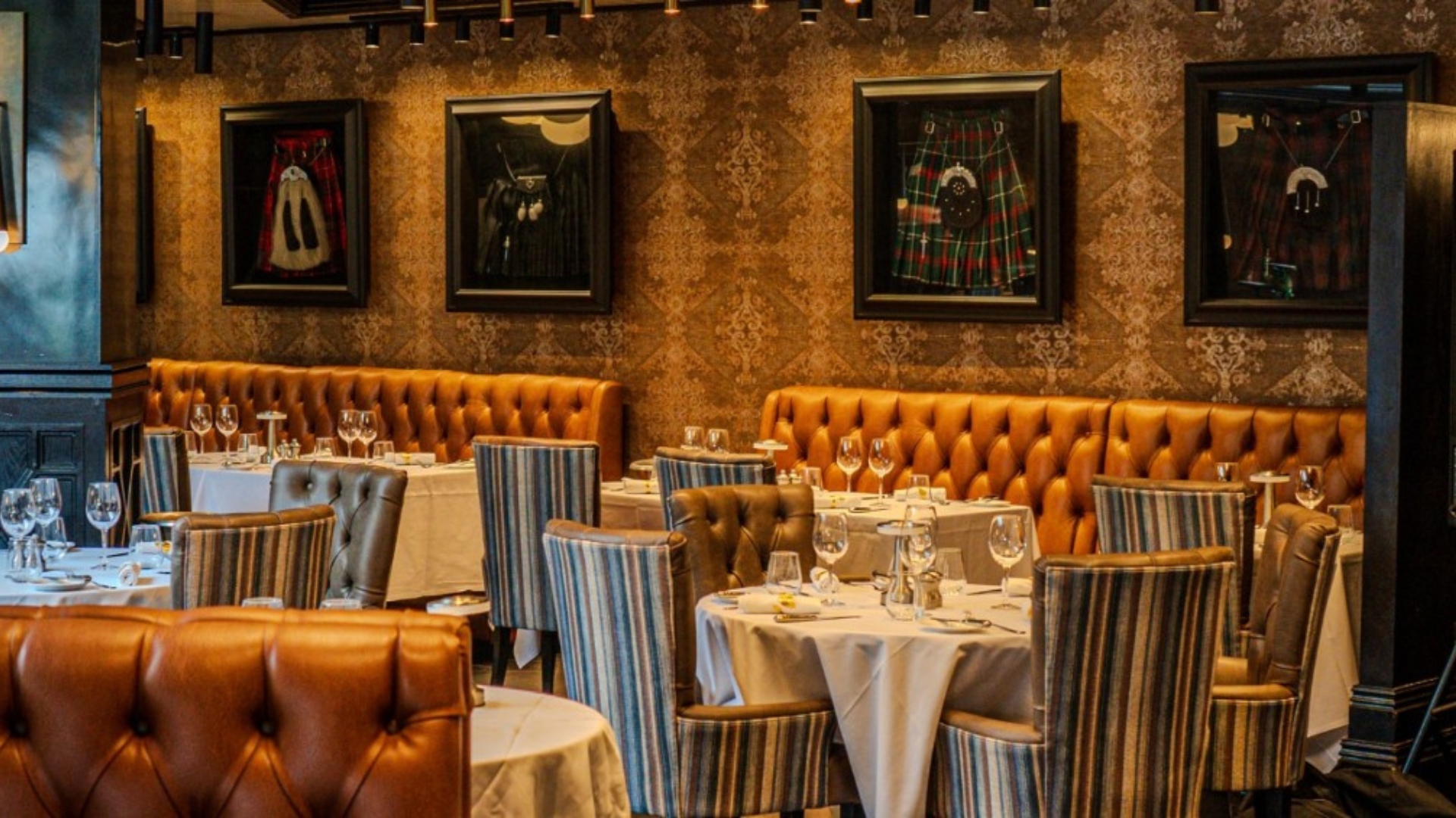A warm, wood-panelled dining room at Cameron House