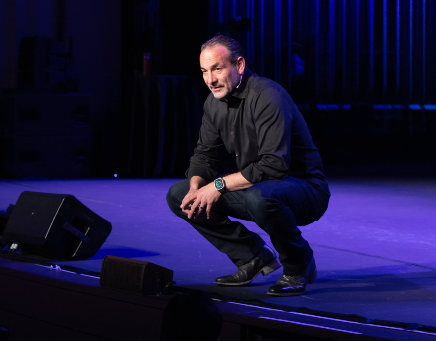 Mel Abraham on stage with his audience