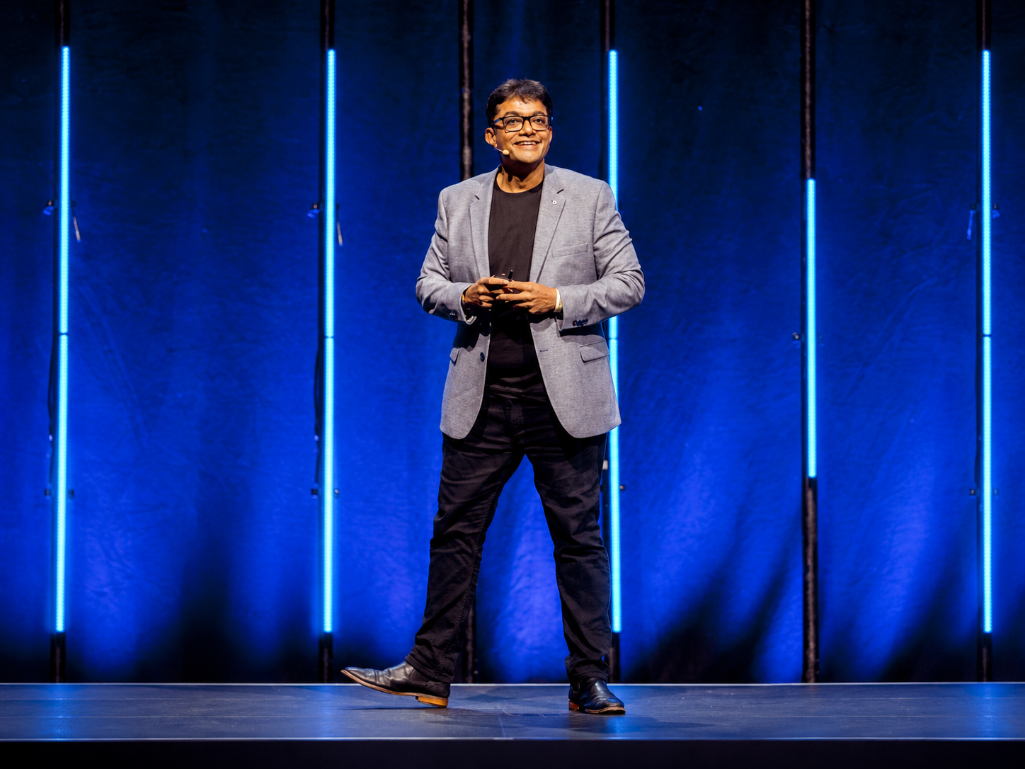 Natchi Lazarus speaking on stage