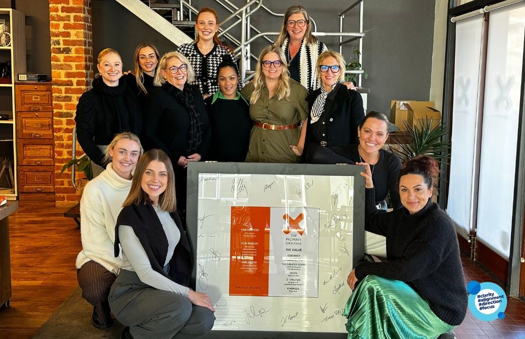 The Property Exchange team with their framed BERM