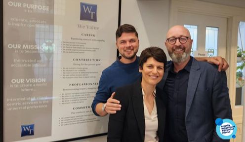 Willis Temby Insurance Brokers team in front of their values wall