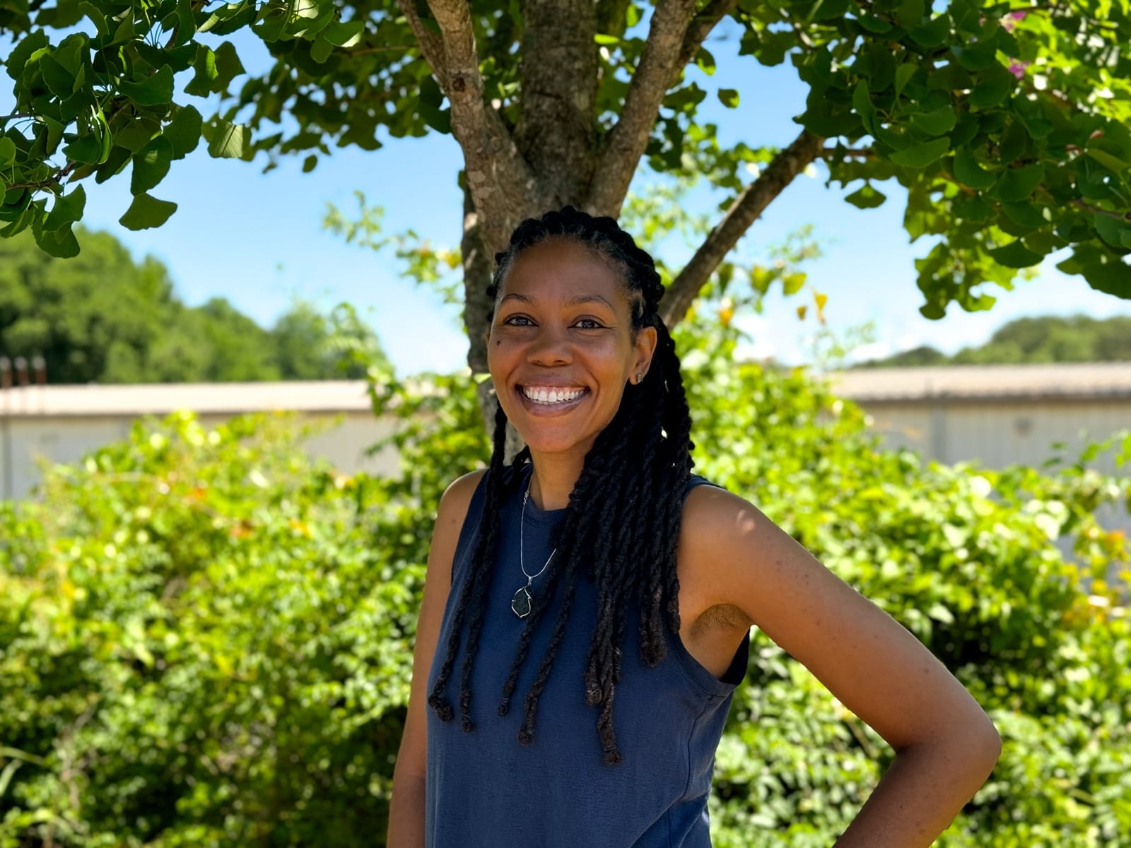 Selima Iwilla Harleston Lust smiling outdoors beneath a tree