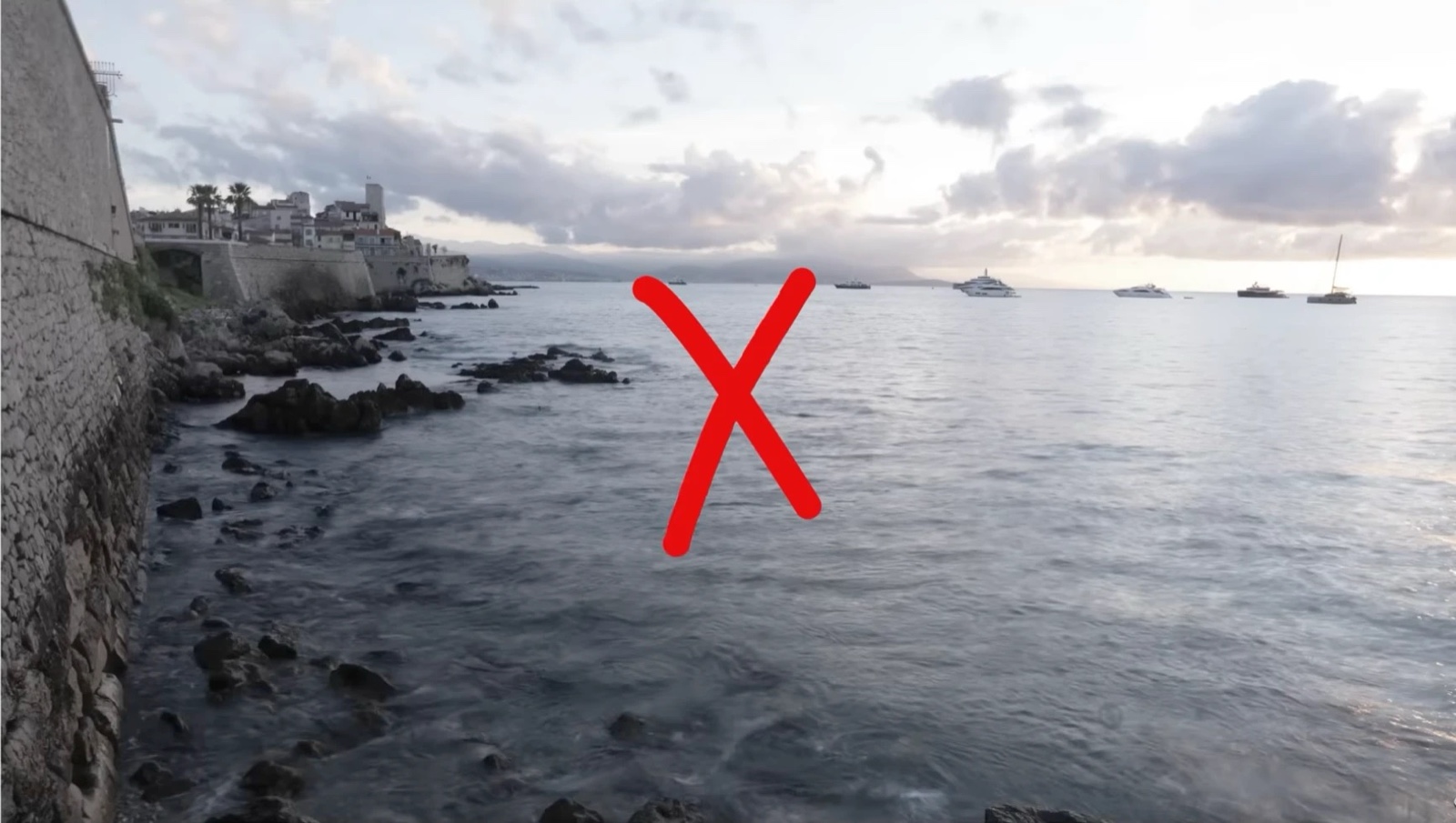 A flat, uneventful shot of the Antibes coastline, taken and moved on from too quickly