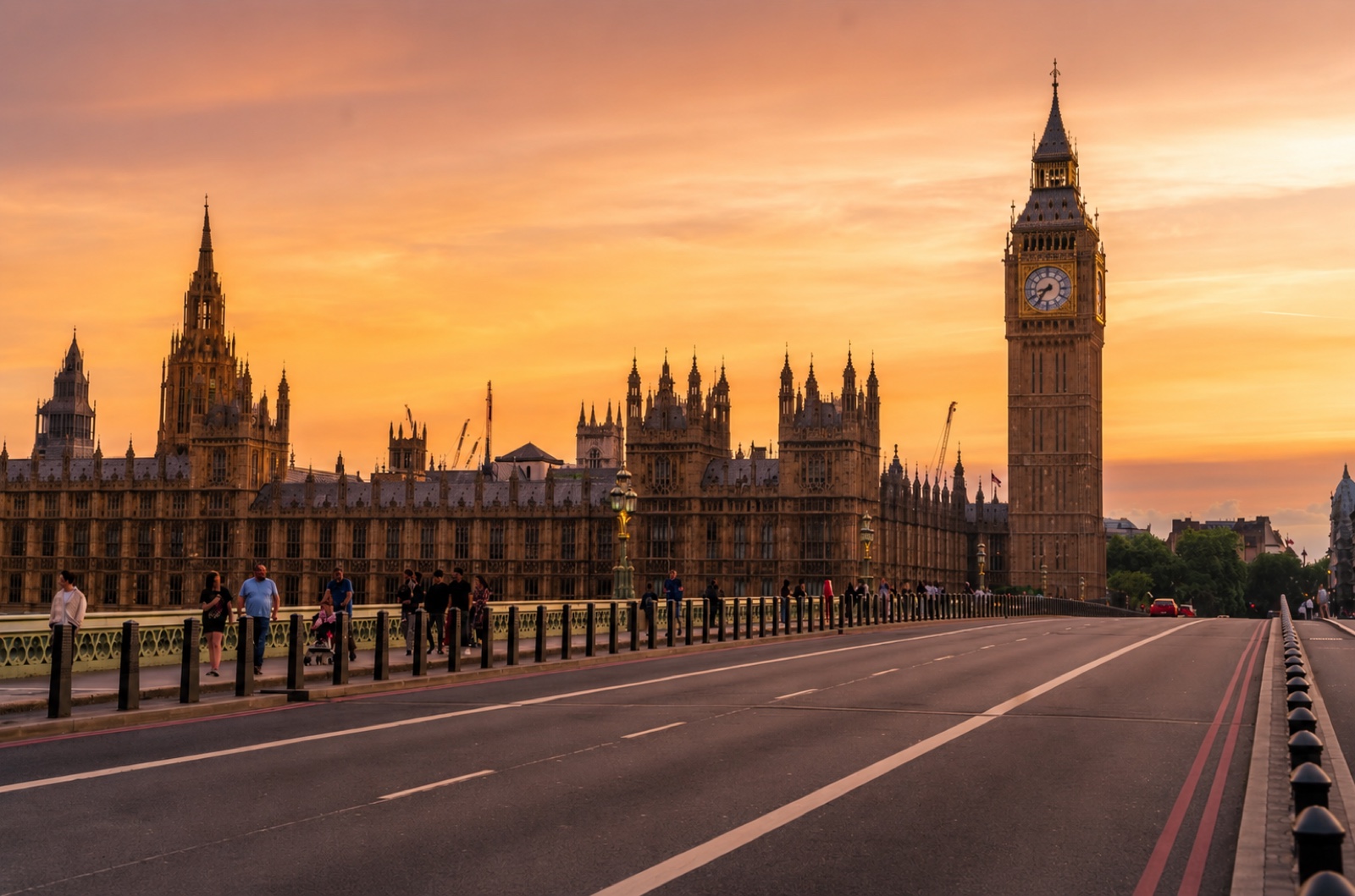 Big Ben and Westminster Bridge, full of tourists, cars, and a bus