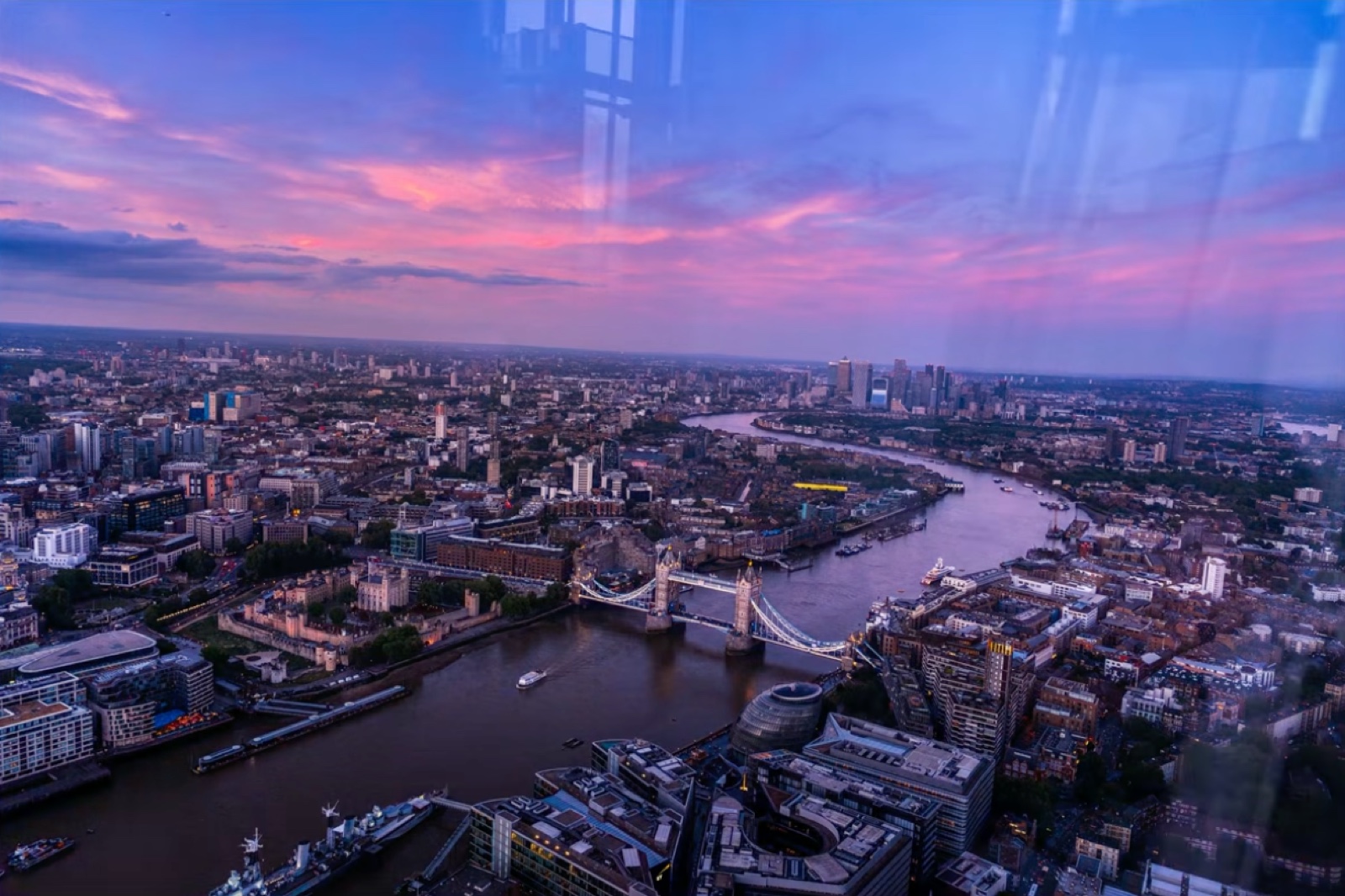 The view from the Shard over London, with window reflection streaks across the sky