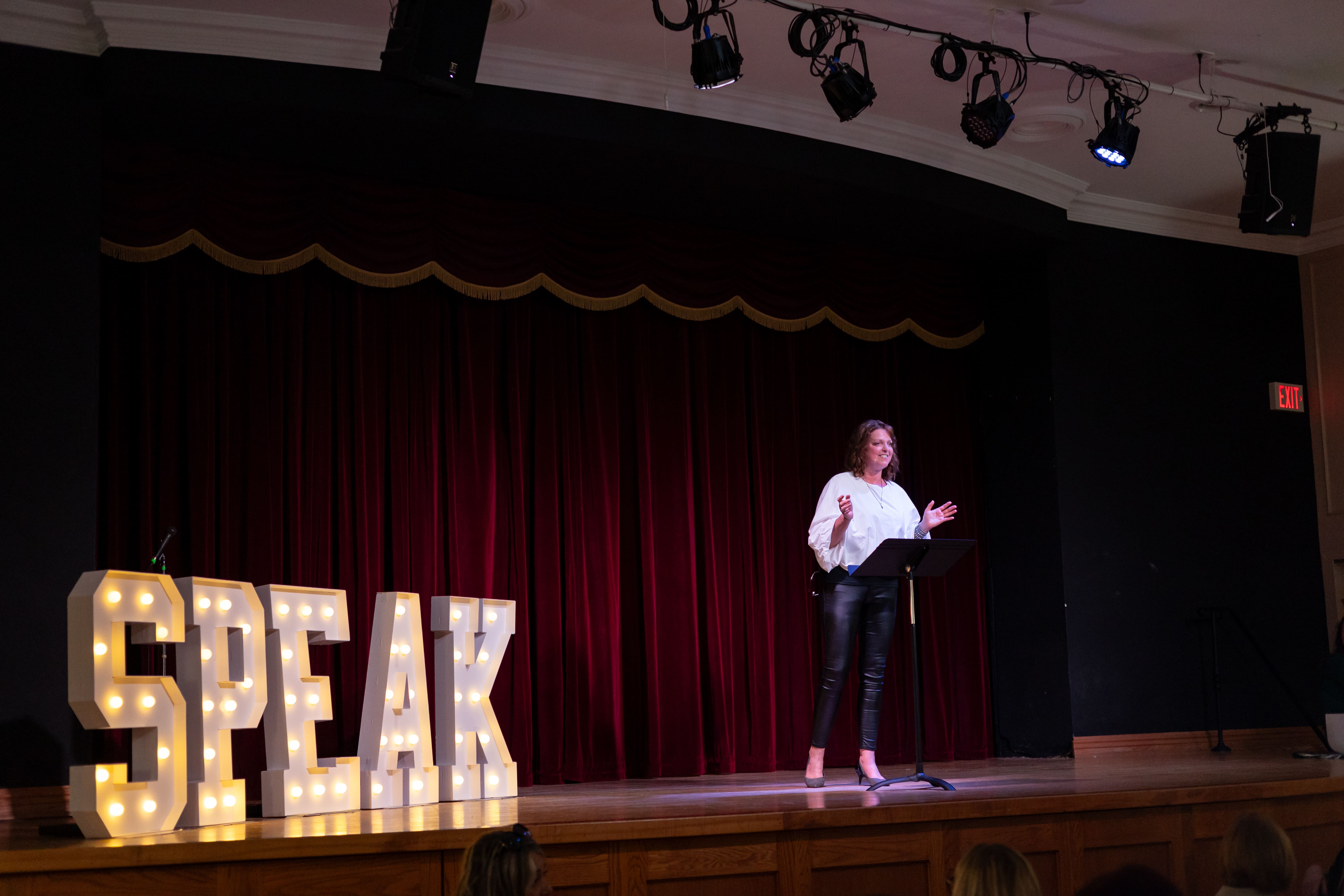 Jen speaking on stage