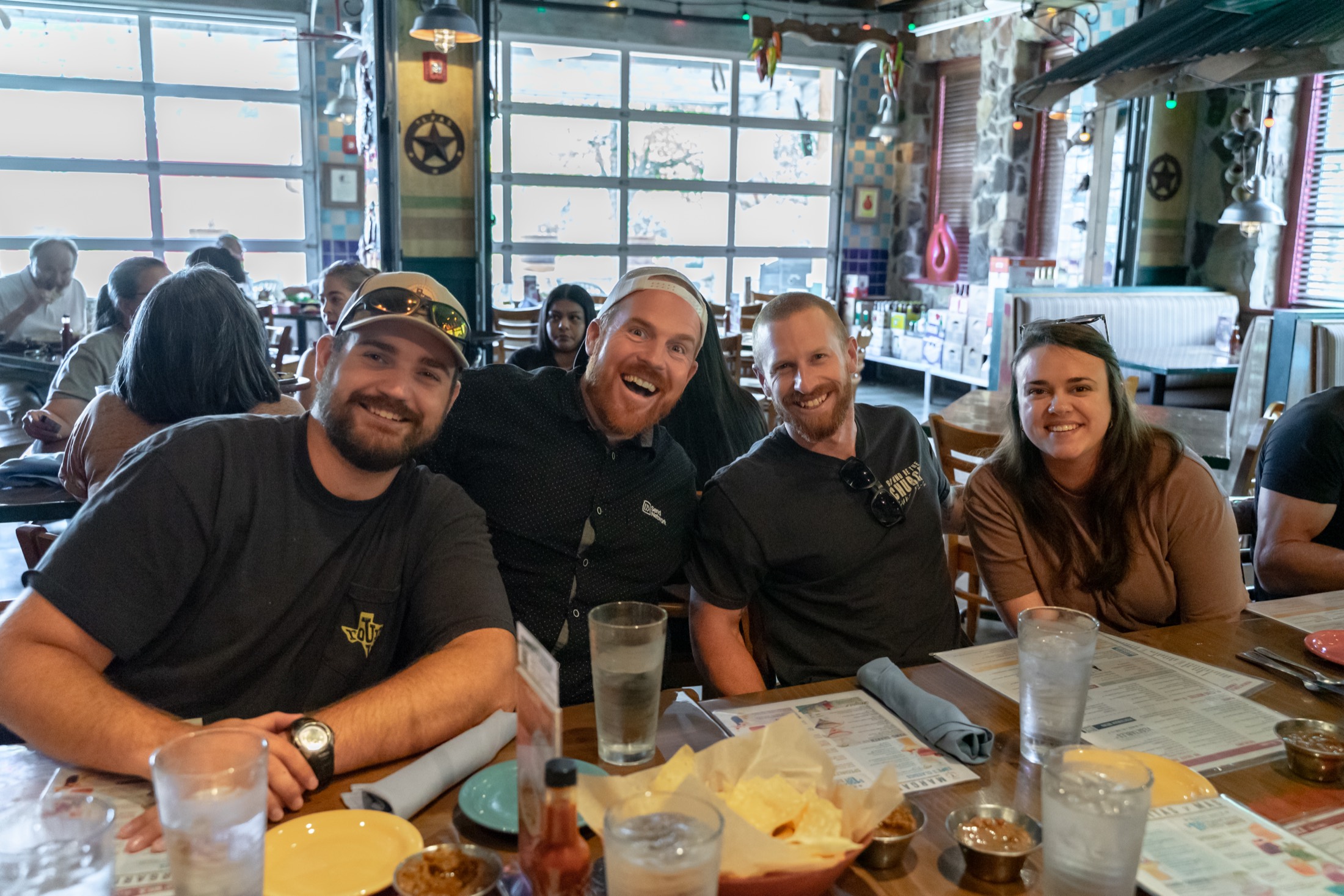 A table of ministry leaders laughing together at an elementum gathering