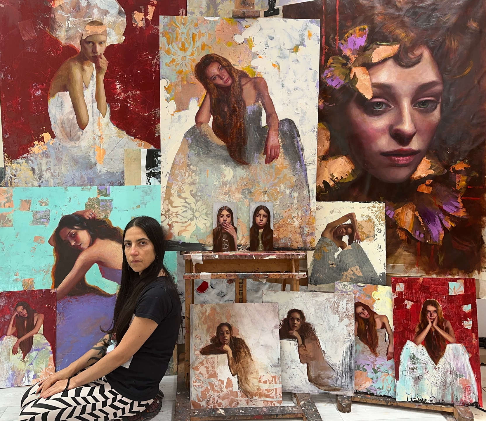Rosso in her studio with her paintings